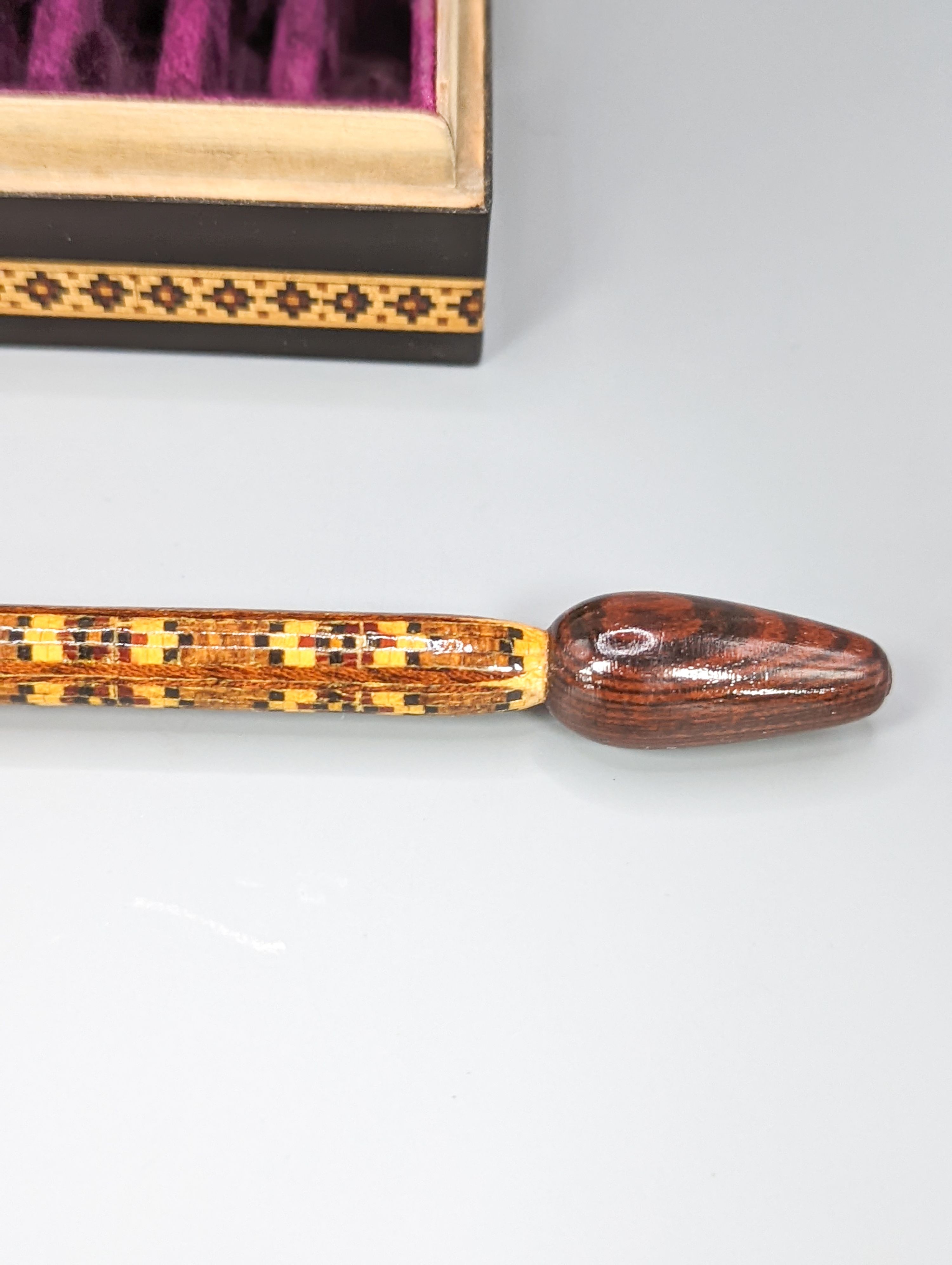 A Victorian Tunbridge ware ebony ground 'dog' ring box, width 9cm, and a stickware glove stretcher